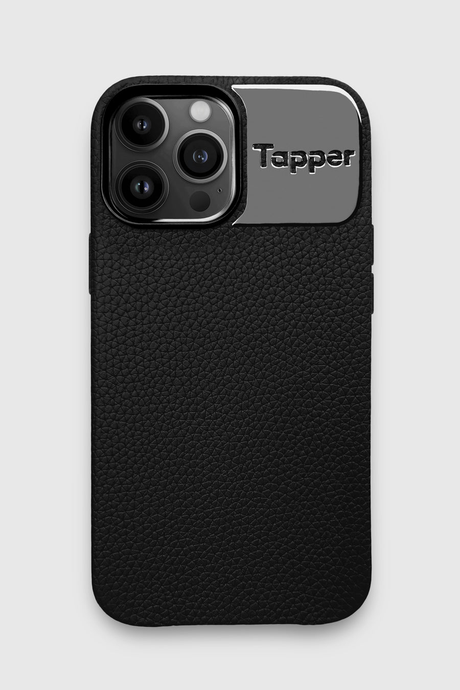 Tapper's luxurious black genuine cow leather iPhone 13 Pro Max case with MagSafe and a metal logo plate in hematite black plating that protects and elevates the look of your iPhone 13 Pro. The next must-have high end protective Apple iPhone accessory in real leather and precious metals. Designed in Sweden by Tapper. Free Express Shipping at gettapper.com