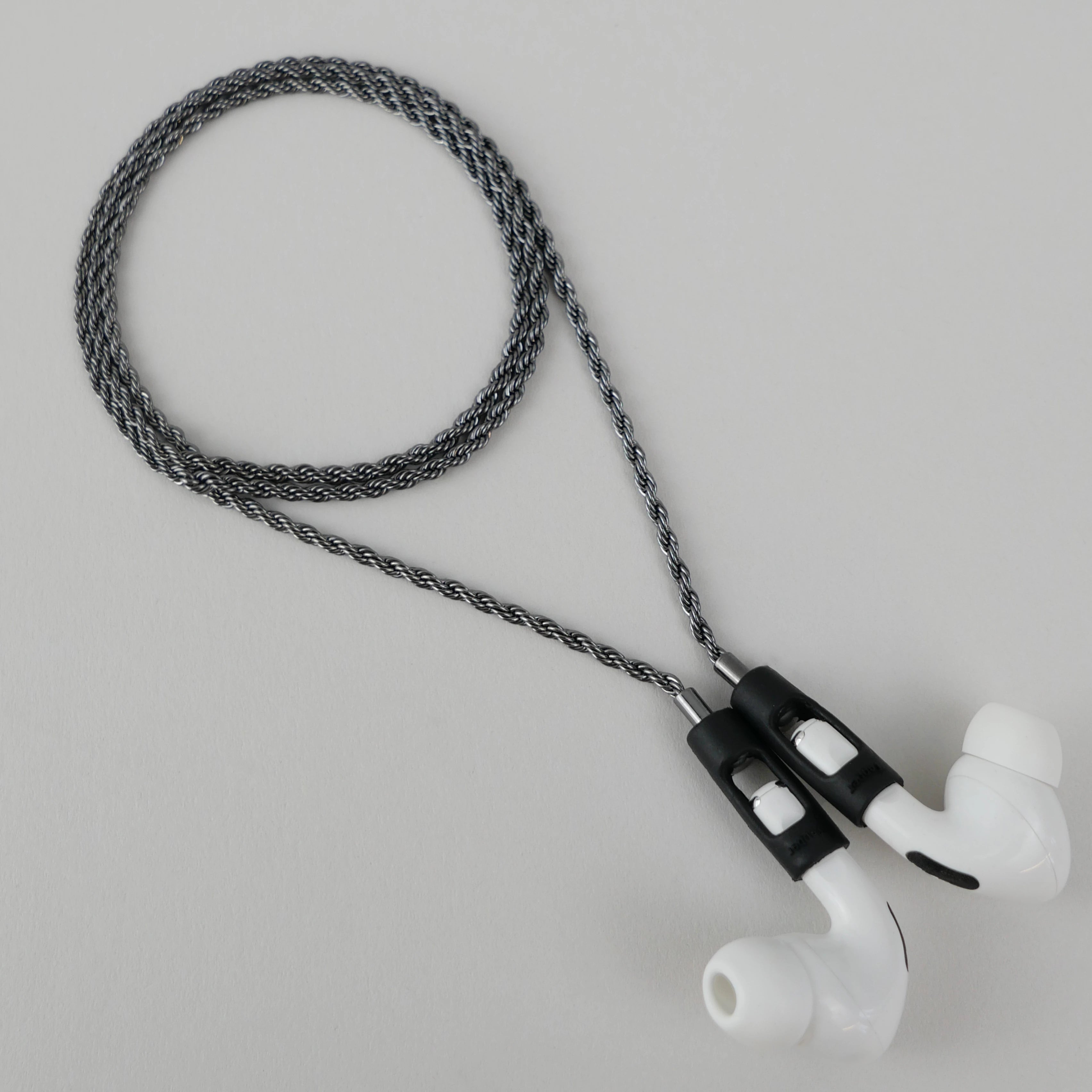 Tapper's real hematite black plated original rope chain jewelry necklace protects your Apple AirPods & AirPods Pro. The luxurious, elevated & accessible rope chain jewellery plated in precious metals snaps the AirPods around your neck. Lost your AirPods? Magnetic lock for convenient and hassle-free safekeeping around your neck. The next must-have & affordable AirPods accessory crafted for ultimate luxury. Compatible with AirPods & AirPods Pro. Designed in Sweden by Tapper. Free Shipping at gettapper.com
