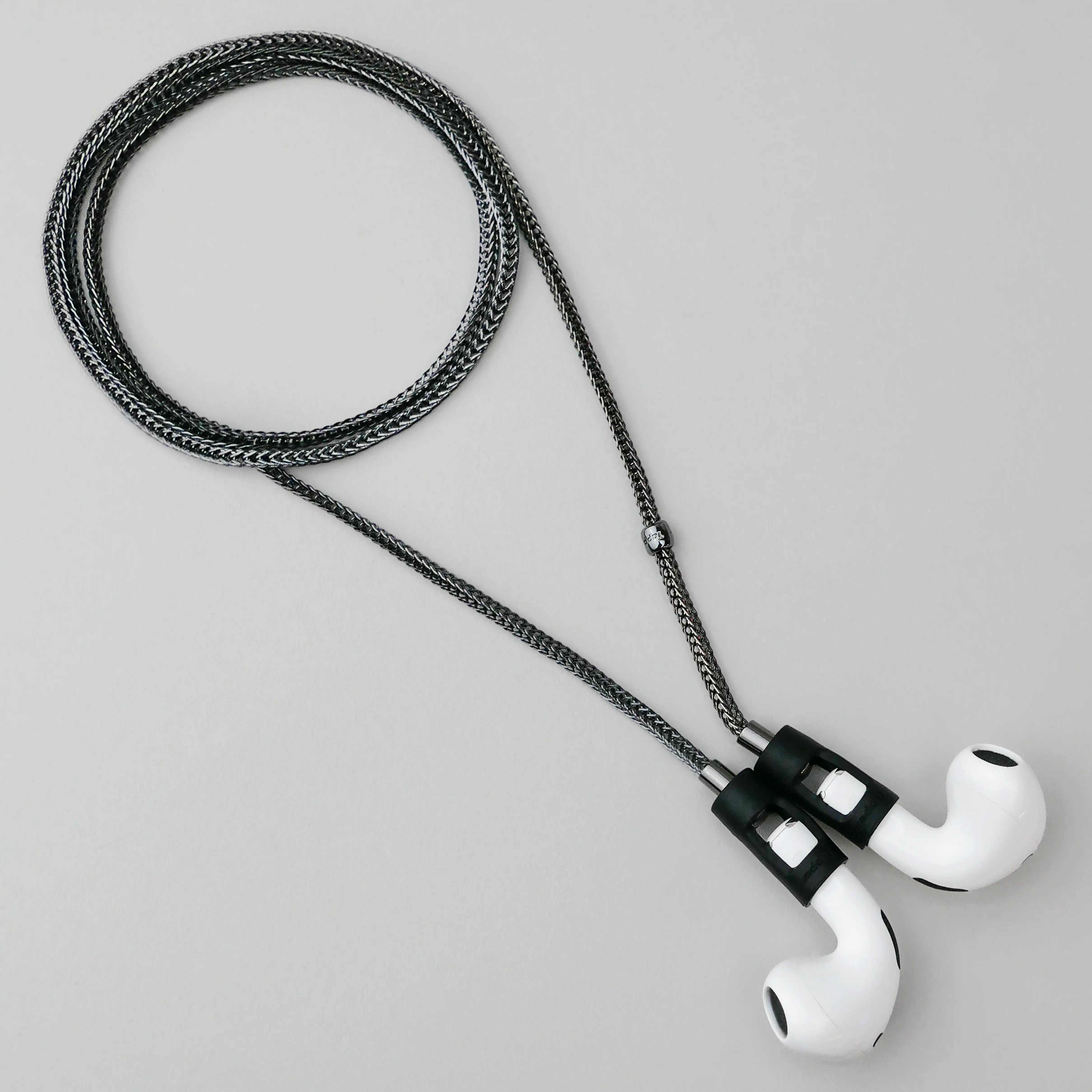Tapper's real hematite black plated original tech jewelry mesh chain protects your AirPods. The luxurious, elevated and accessible necklace plated in precious metals steps up your AirPod jewellery game. Worried about losing your AirPods? Magnetic lock for convenient and hassle-free safekeeping around the neck. The next must-have AirPods accessory crafted for ultimate luxury. Compatible with all generations of Apple AirPods and AirPods Pro. Designed in Sweden by Tapper. Free Express Shipping at gettapper.com