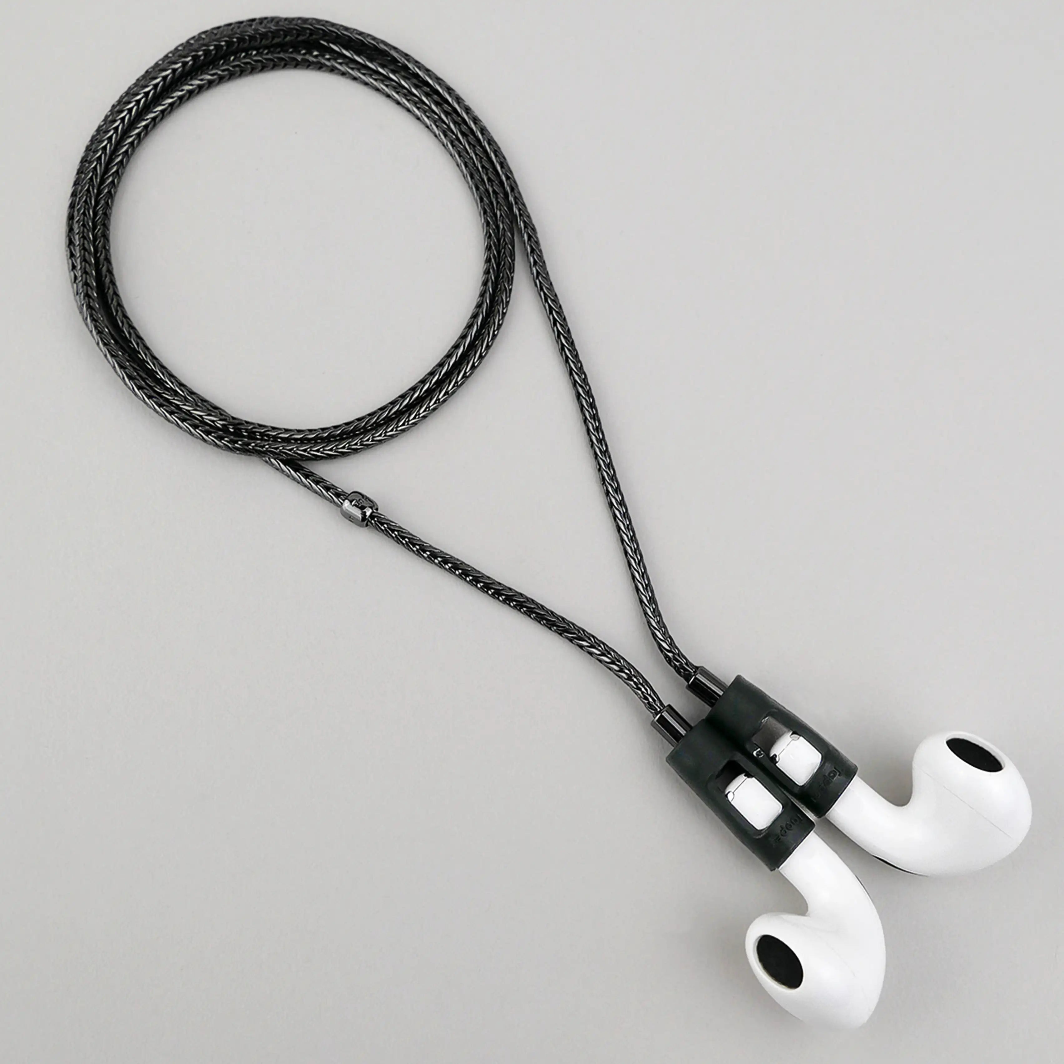 Tapper's hematite black plated original tech jewelry foxtail chain protects your AirPods. The luxurious, elevated and accessible necklace plated in precious metals steps up your AirPod jewellery game. Worried about losing your AirPods? Magnetic lock for convenient and hassle-free safekeeping around the neck. The next must-have AirPods accessory crafted for ultimate luxury. Compatible with all generations of Apple AirPods and AirPods Pro. Designed in Sweden by Tapper. Free Express Shipping at gettapper.com