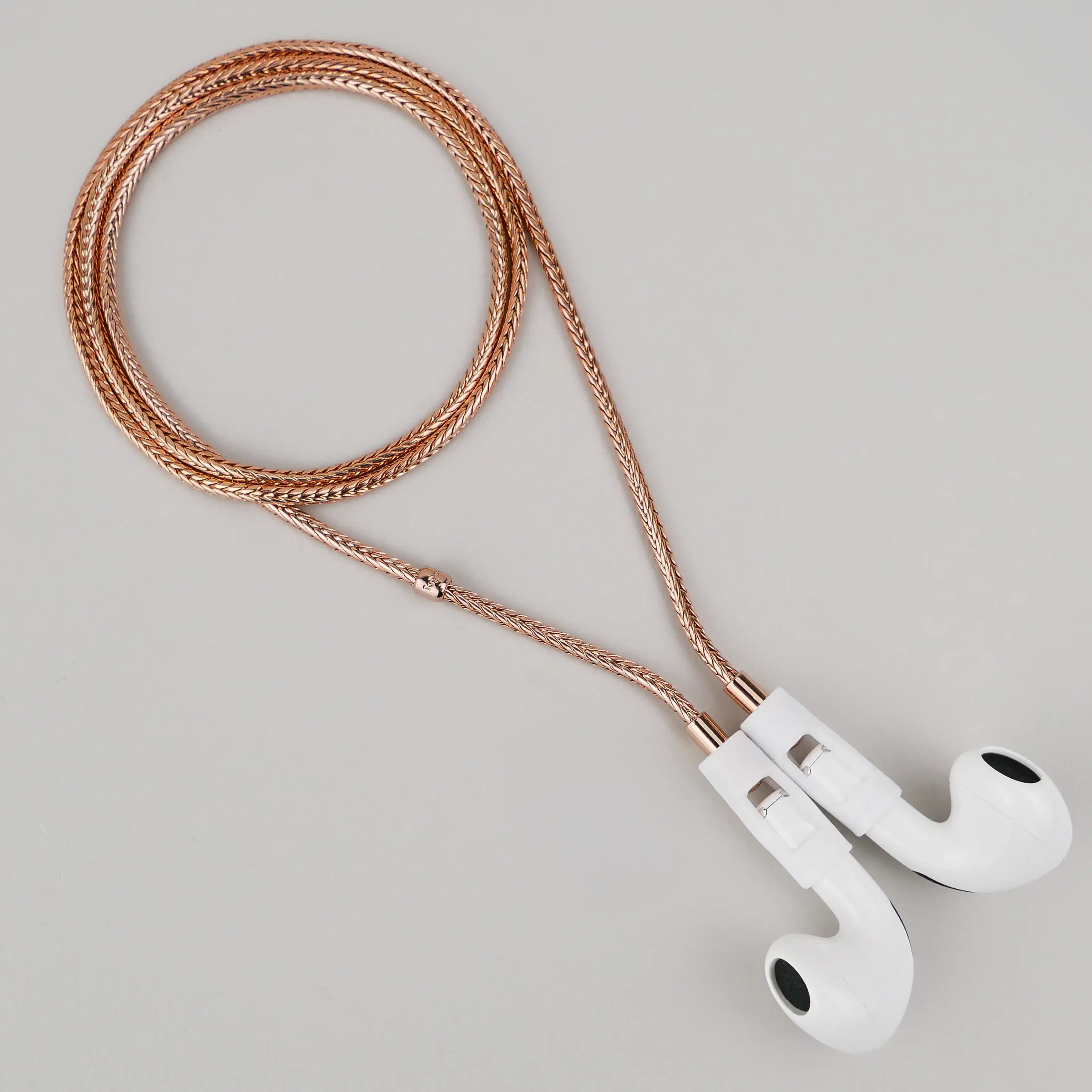 Tapper's real 18K rose gold plated original tech jewelry foxtail chain protects your AirPods. The luxurious, elevated and accessible necklace plated in precious metals steps up your AirPod jewellery game. Worried about losing your AirPods? Magnetic lock for convenient and hassle-free safekeeping around the neck. The next must-have AirPods accessory crafted for ultimate luxury. Compatible with all generations of Apple AirPods and AirPods Pro. Designed in Sweden by Tapper. Free Express Shipping.