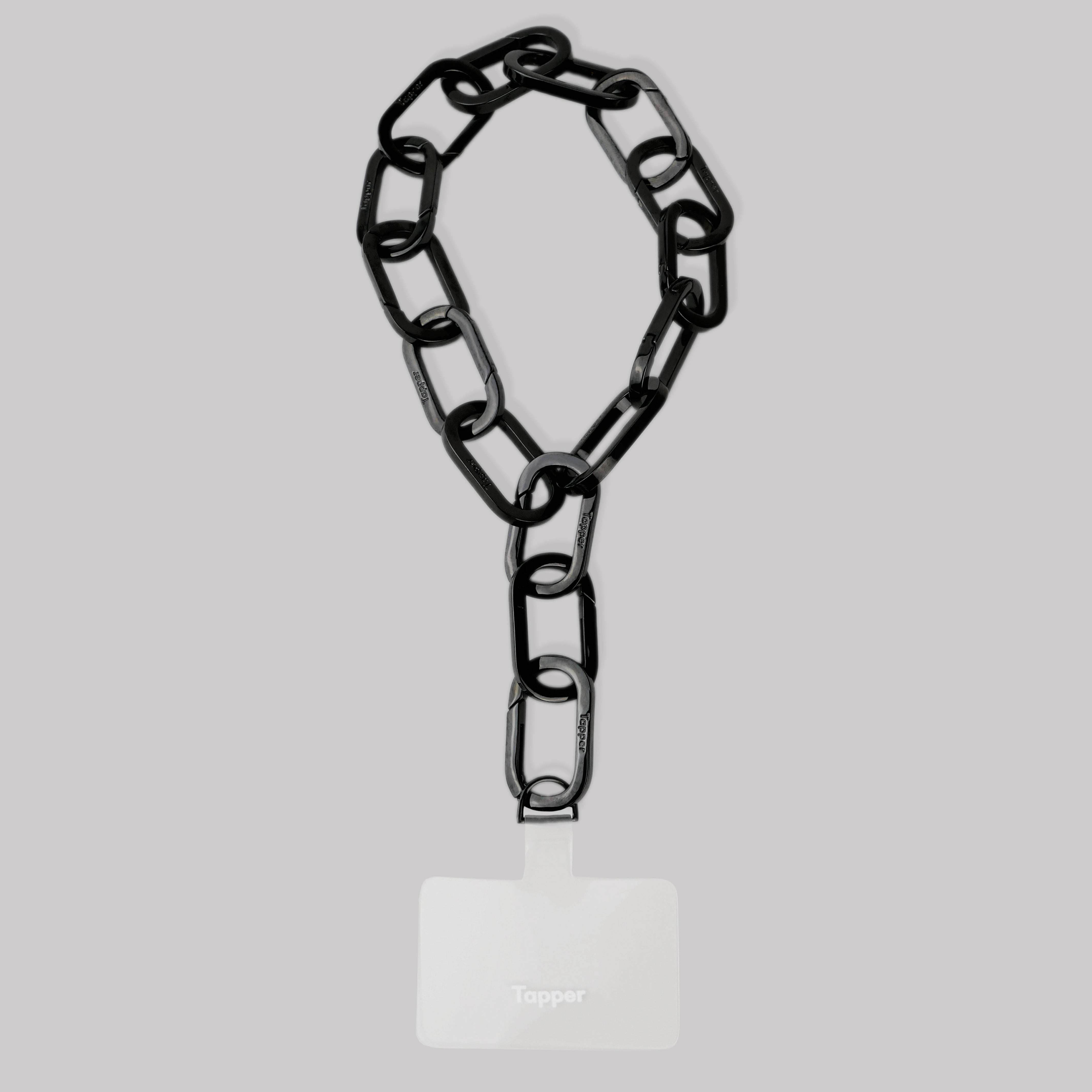 Tapper's Adjustable Phone Carabiner Wristlet Strap is an elevated metal phone wrist chain plated in black, designed to complement your phone case and your jewellery. Combine style with function by securing your phone to your wrist, belt loop or bag, protecting it from drops and falls as well as keeping it safe from pickpocketing. When not in use as a phone chain, adjust the carabiner links and use it as a bracelet or necklace instead. Compatible with all phone cases (iPhone, Samsung, Xiaomi, Oppo,Vivo