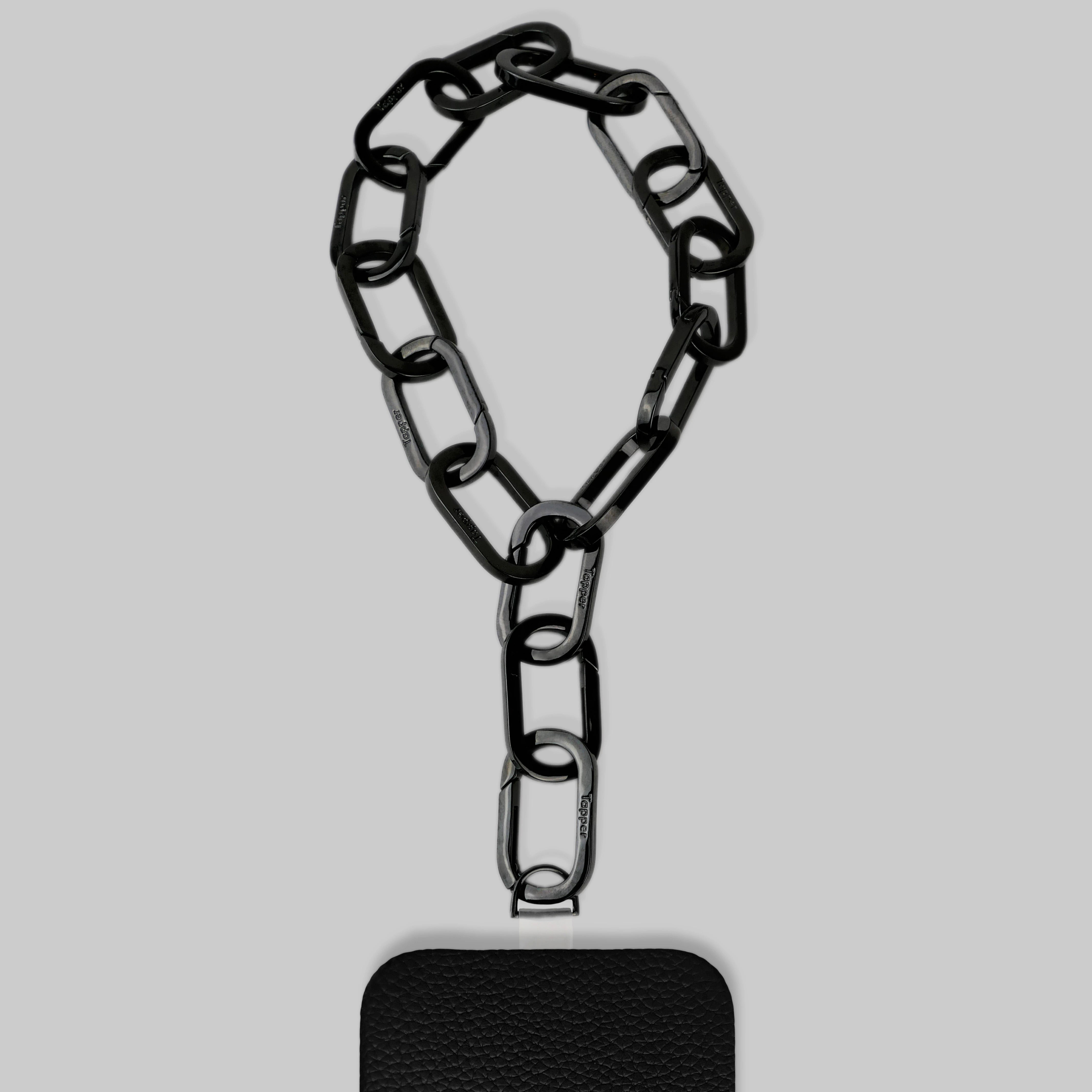 Tapper's Adjustable Phone Carabiner Wristlet Strap is an elevated metal phone wrist chain plated in black, designed to complement your phone case and your jewellery. Combine style with function by securing your phone to your wrist, belt loop or bag, protecting it from drops and falls as well as keeping it safe from pickpocketing. When not in use as a phone chain, adjust the carabiner links and use it as a bracelet or necklace instead. Compatible with all phone cases (iPhone, Samsung, Xiaomi, Oppo,Vivo
