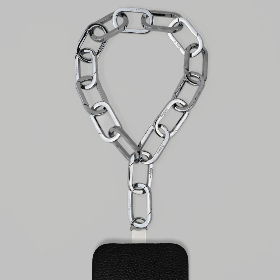 Tapper's Adjustable Phone Carabiner Wristlet Strap is an elevated metal phone wrist chain colored in Silver, designed to complement your phone case and your jewellery. Combine style with function by securing your phone to your wrist, belt loop or bag, protecting it from drops and falls as well as keeping it safe from pickpocketing. When not in use as a phone chain, adjust the carabiner links and use it as a bracelet or necklace instead. Compatible with all phone cases (iPhone, Samsung, Xiaomi, Oppo,Vivo