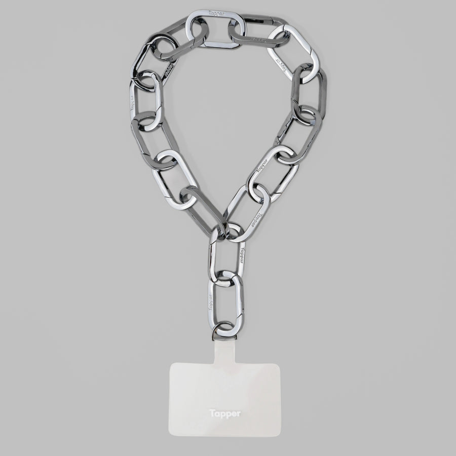 Tapper's Adjustable Phone Carabiner Wristlet Strap is an elevated metal phone wrist chain colored in Silver, designed to complement your phone case and your jewellery. Combine style with function by securing your phone to your wrist, belt loop or bag, protecting it from drops and falls as well as keeping it safe from pickpocketing. When not in use as a phone chain, adjust the carabiner links and use it as a bracelet or necklace instead. Compatible with all phone cases (iPhone, Samsung, Xiaomi, Oppo,Vivo