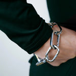 Tapper's Adjustable Phone Carabiner Wristlet Strap is an elevated metal phone wrist chain colored in Silver, designed to complement your phone case and your jewellery. Combine style with function by securing your phone to your wrist, belt loop or bag, protecting it from drops and falls as well as keeping it safe from pickpocketing. When not in use as a phone chain, adjust the carabiner links and use it as a bracelet or necklace instead. Compatible with all phone cases (iPhone, Samsung, Xiaomi, Oppo,Vivo