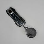 Black Metal Plated AirTag Holder & Case – Luxurious and Secure – A refined metal carabiner case designed to elegantly secure your AirTag to car keys, bags, luggage, and more. Crafted by Tapper in Sweden.