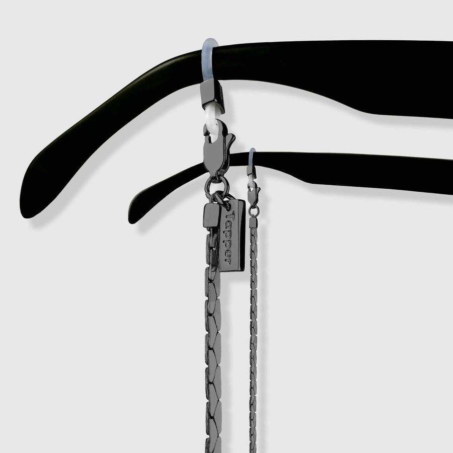 Protect, elevate and keep track of your eyewear with this Hematite Matte Black plated eyewear, eyeglasses and sunglasses chain from Tapper, ensuring elegant and convenient safekeeping around your neck. When not in use as an eyewear chain, detach the silicone holders from the lobster clasps and use it as a necklace, bracelet or pair it with another set of chains as body jewelry / jewellery. Designed in Sweden.