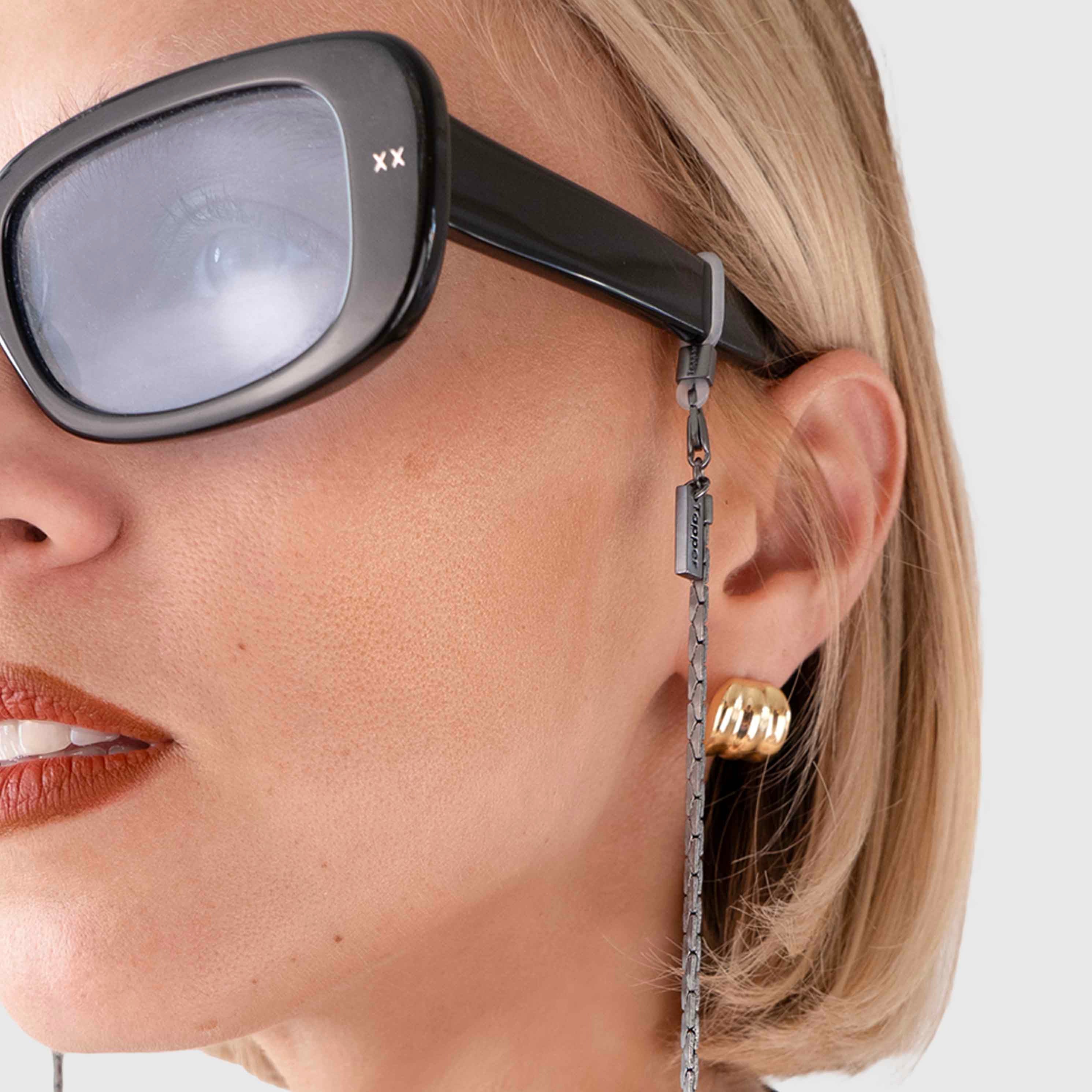 Protect, elevate and keep track of your eyewear with this Hematite Matte Black plated eyewear, eyeglasses and sunglasses chain from Tapper, ensuring elegant and convenient safekeeping around your neck. When not in use as an eyewear chain, detach the silicone holders from the lobster clasps and use it as a necklace, bracelet or pair it with another set of chains as body jewelry / jewellery. Designed in Sweden.