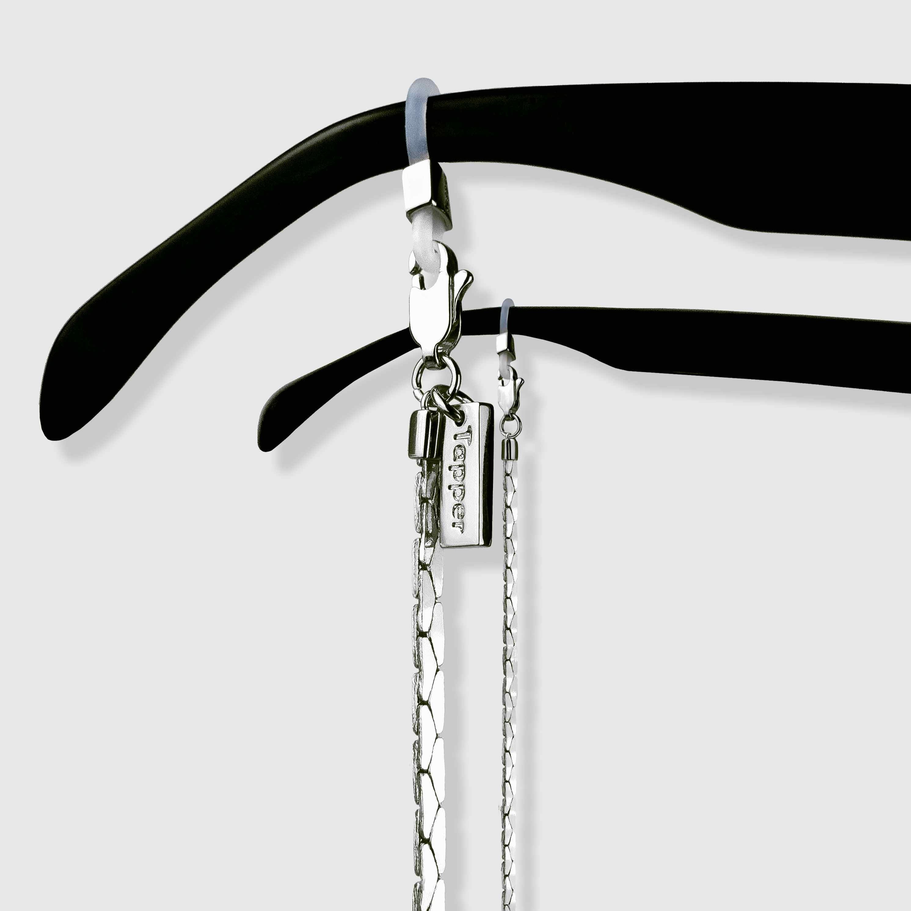 Protect, elevate and keep track of your eyewear with this 925 Silver plated eyewear, eyeglasses and sunglasses chain from Tapper, ensuring elegant and convenient safekeeping around your neck. When not in use as an eyewear chain, detach the silicone holders from the lobster clasps and use it as a necklace, bracelet or pair it with another set of chains as body jewelry / jewellery. Designed in Sweden.