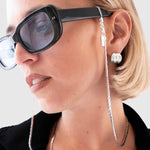 Protect, elevate and keep track of your eyewear with this 925 Silver plated eyewear, eyeglasses and sunglasses chain from Tapper, ensuring elegant and convenient safekeeping around your neck. When not in use as an eyewear chain, detach the silicone holders from the lobster clasps and use it as a necklace, bracelet or pair it with another set of chains as body jewelry / jewellery. Designed in Sweden.