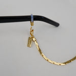 18K Gold Plated Glasses Chain by Tapper – Keep your eyewear secure and stylish with this elegant eyewear accessory. Designed in Sweden, this versatile chain fits eyeglasses and sunglasses, doubling as a necklace, bracelet, or body jewelry.