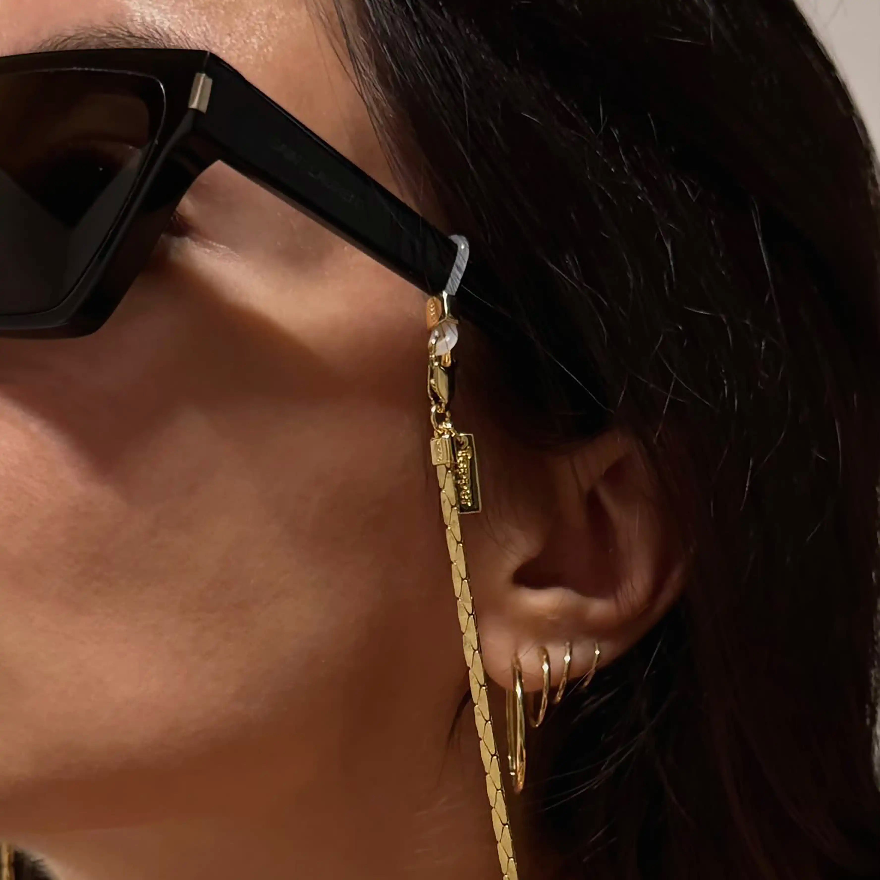 Protect, elevate and keep track of your eyewear with this 18K Gold plated eyewear, eyeglasses and sunglasses chain from Tapper, ensuring elegant and convenient safekeeping around your neck. When not in use as an eyewear chain, detach the silicone holders from the lobster clasps and use it as a necklace, bracelet or pair it with another set of chains as body jewelry / jewellery. Designed in Sweden.