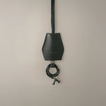 Handmade black leather AirPods strap and leather key holder with keychain and pouch ring, crafted in Sweden