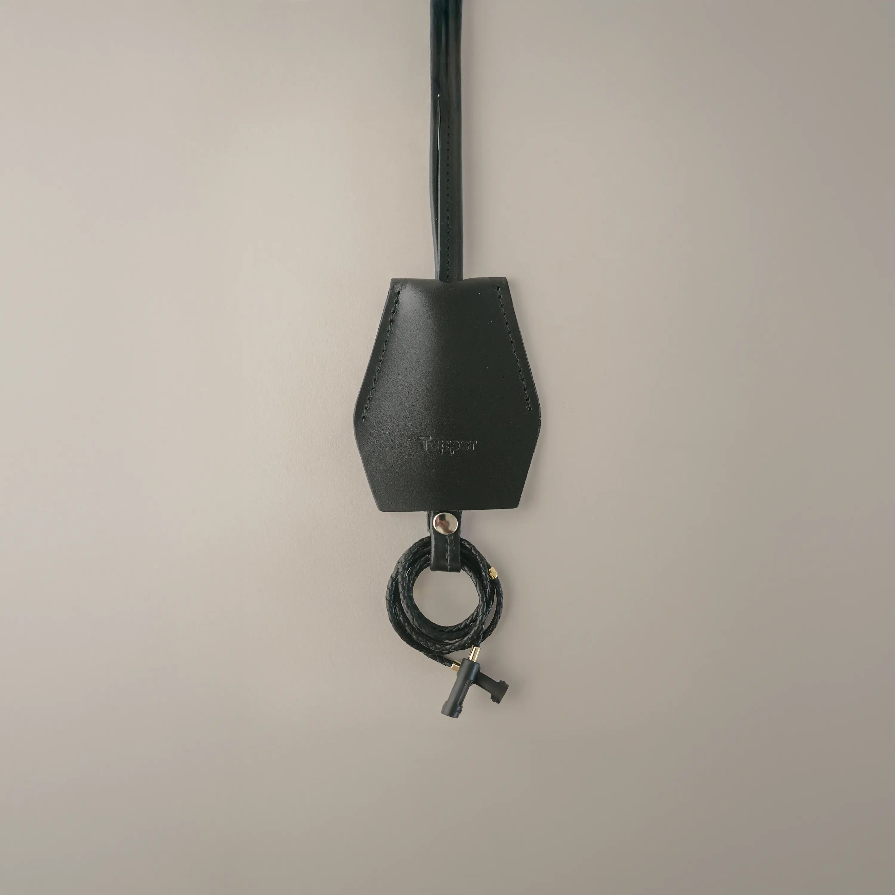 Handmade black leather AirPods strap and leather key holder with keychain and pouch ring, crafted in Sweden