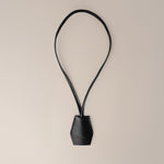 Handmade black leather AirPods strap and leather key holder with keychain and pouch ring, crafted in Sweden