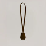 Handmade black leather AirPods strap and leather key holder with keychain and pouch ring, crafted in Sweden