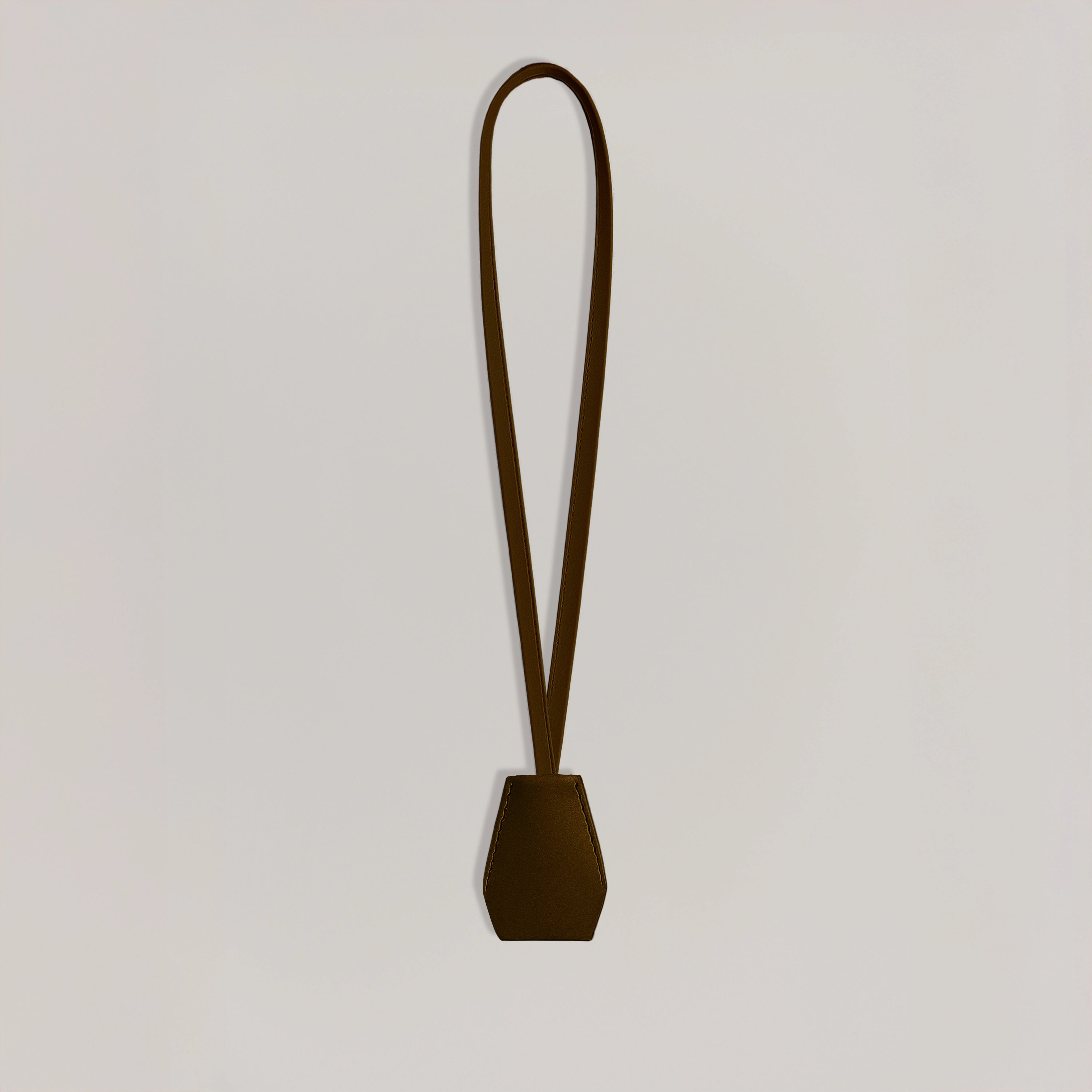 Handmade black leather AirPods strap and leather key holder with keychain and pouch ring, crafted in Sweden