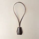 Handmade black leather AirPods strap and leather key holder with keychain and pouch ring, crafted in Sweden