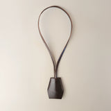 Handmade black leather AirPods strap and leather key holder with keychain and pouch ring, crafted in Sweden