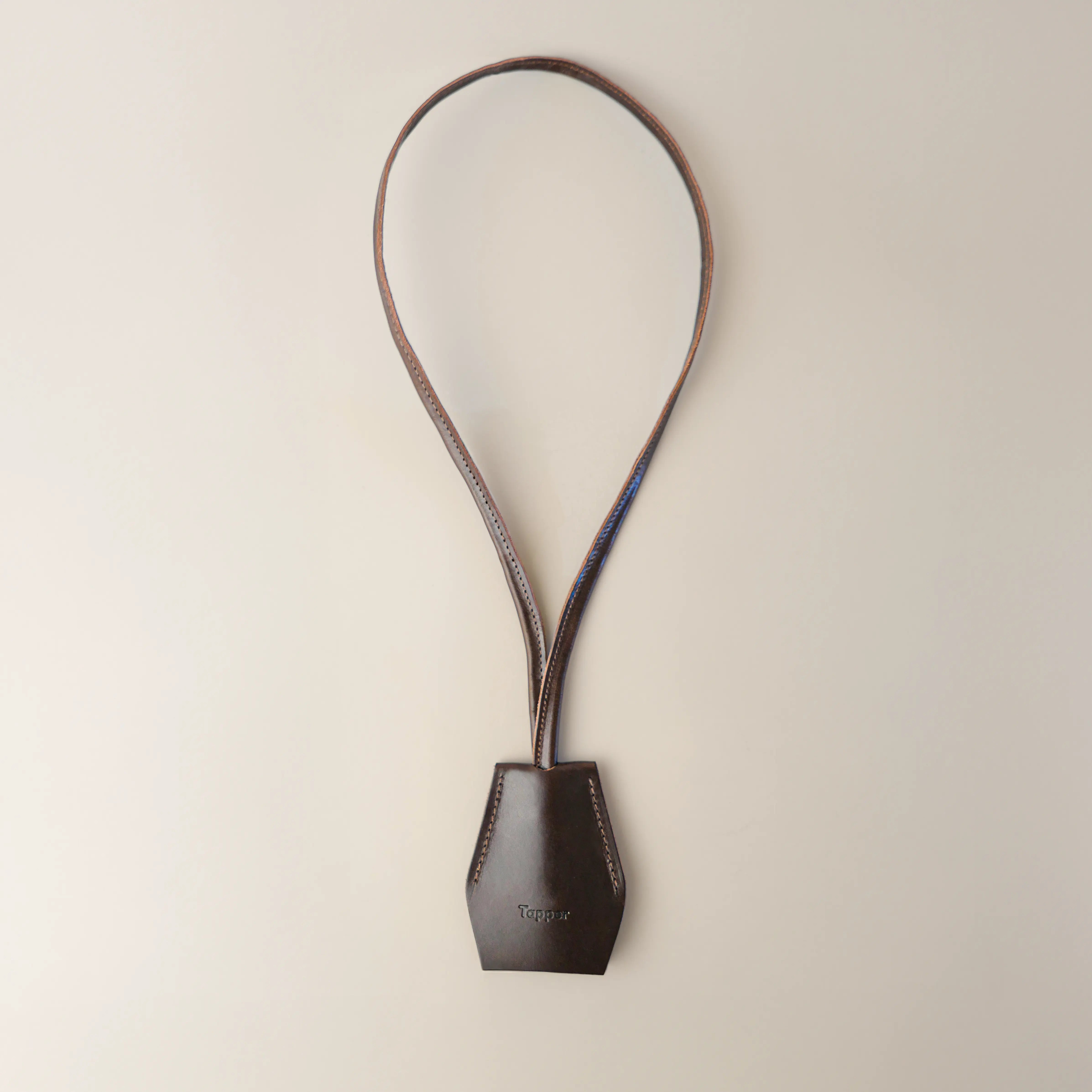Handmade black leather AirPods strap and leather key holder with keychain and pouch ring, crafted in Sweden