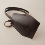 Handmade black leather AirPods strap and leather key holder with keychain and pouch ring, crafted in Sweden