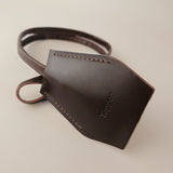 Handmade black leather AirPods strap and leather key holder with keychain and pouch ring, crafted in Sweden