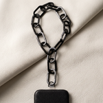 Tapper's Adjustable Phone Carabiner Wristlet Strap is an elevated metal phone wrist chain plated in black, designed to complement your phone case and your jewellery. Combine style with function by securing your phone to your wrist, belt loop or bag, protecting it from drops and falls as well as keeping it safe from pickpocketing. When not in use as a phone chain, adjust the carabiner links and use it as a bracelet or necklace instead. Compatible with all phone cases (iPhone, Samsung, Xiaomi, Oppo,Vivo