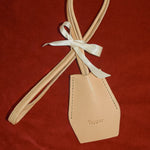 Handmade black leather AirPods strap and leather key holder with keychain and pouch ring, crafted in Sweden