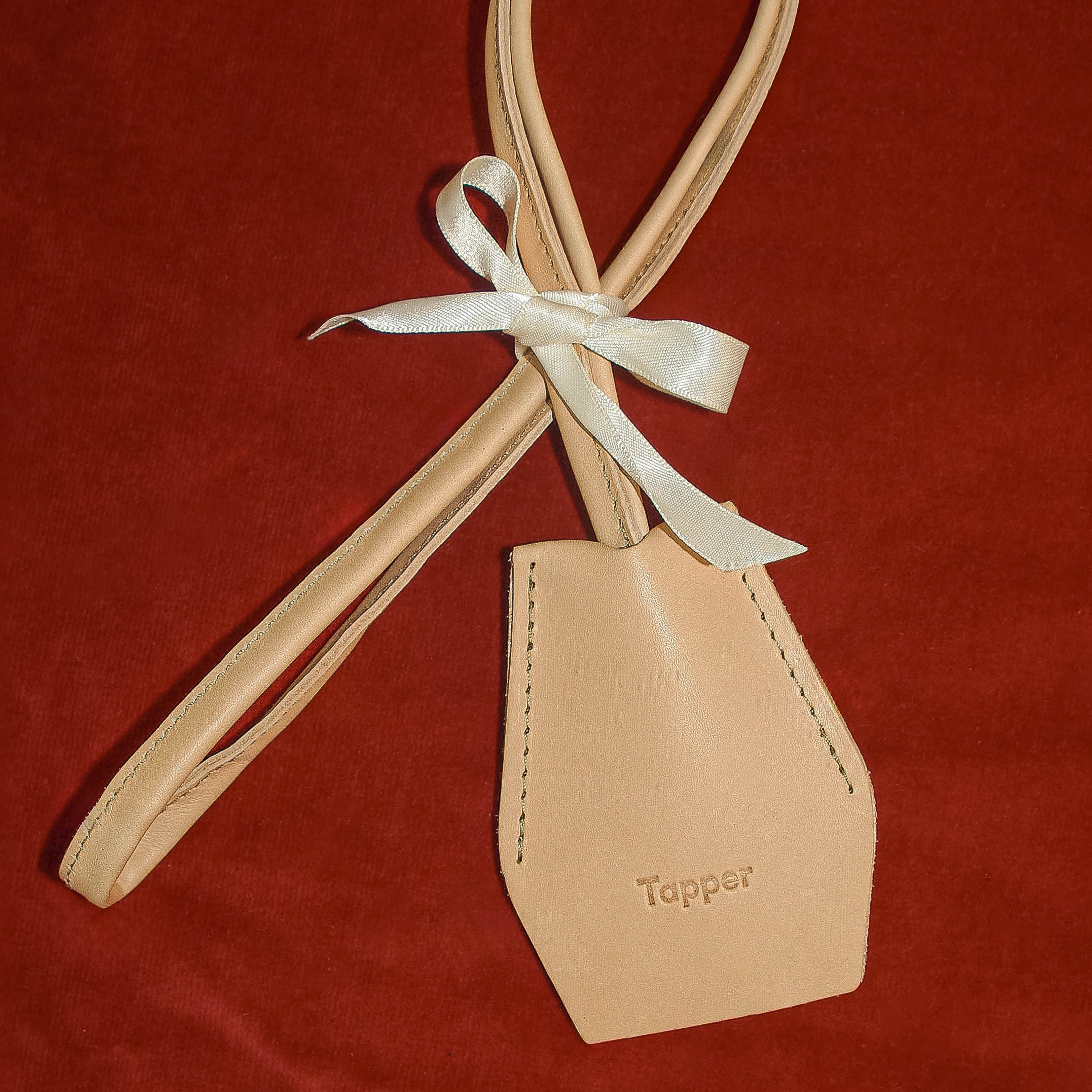 Handmade black leather AirPods strap and leather key holder with keychain and pouch ring, crafted in Sweden