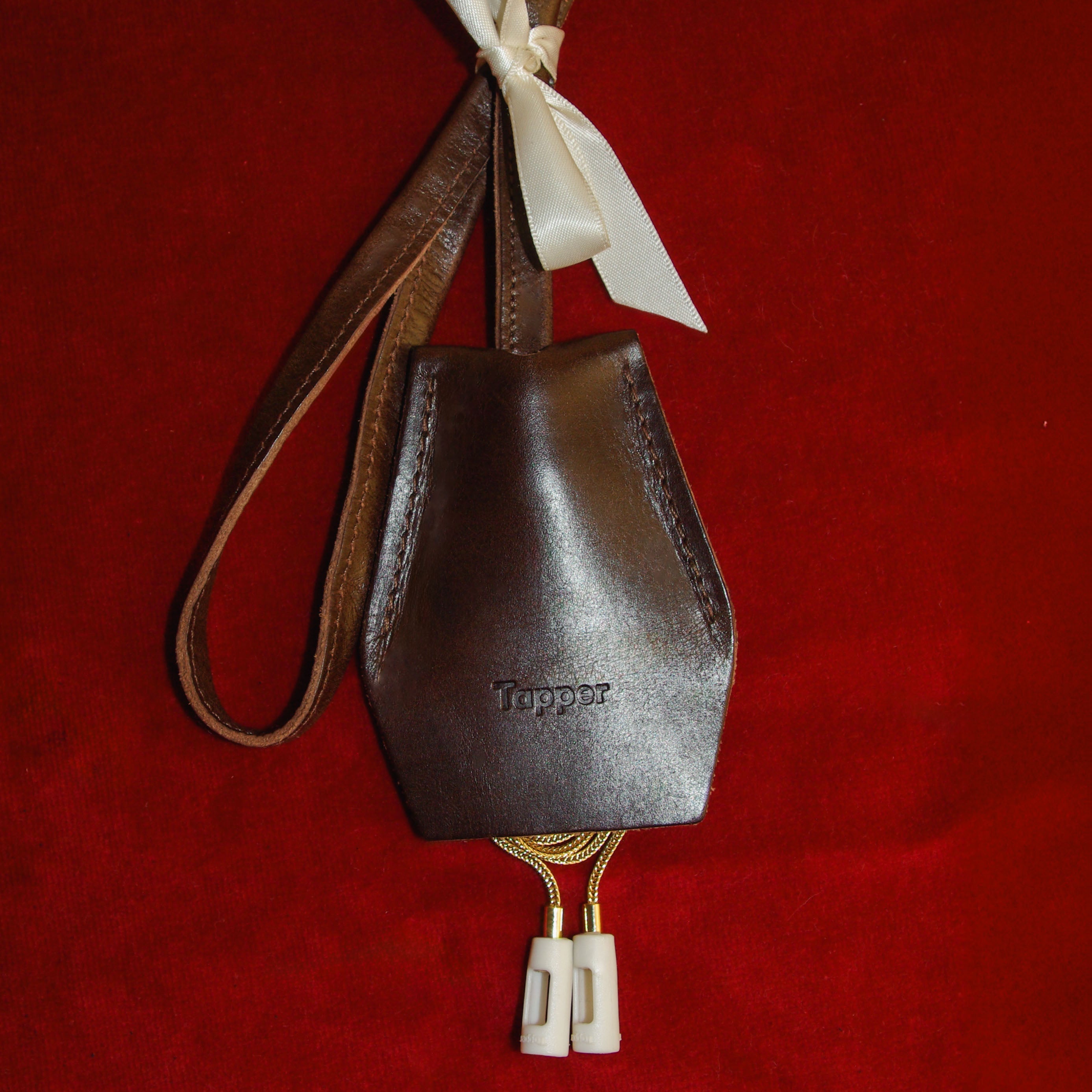 Handmade black leather AirPods strap and leather key holder with keychain and pouch ring, crafted in Sweden