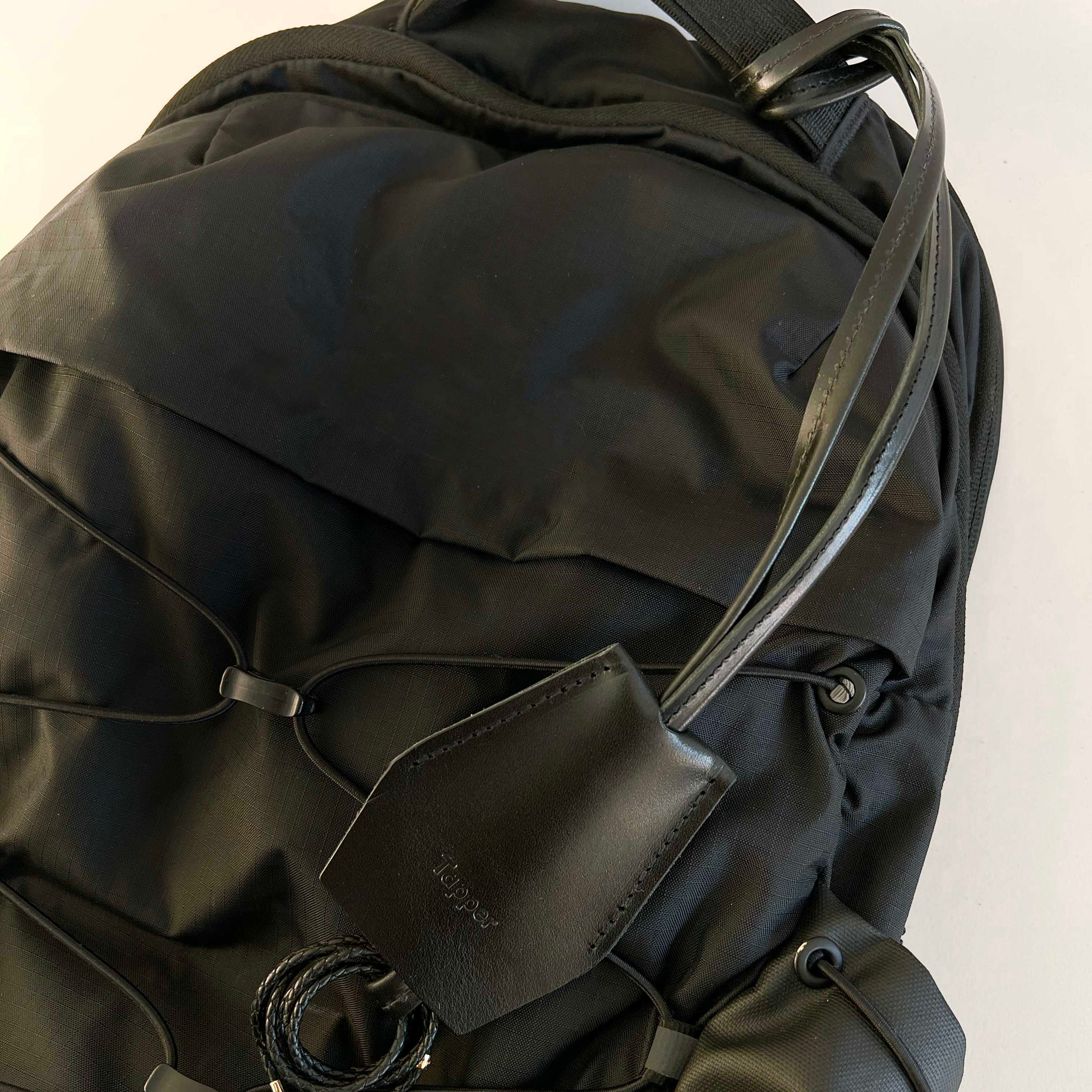 Handmade black leather AirPods strap and leather key holder with keychain and pouch ring, crafted in Sweden