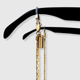 Protect, elevate and keep track of your eyewear with this 18K Gold plated eyewear, eyeglasses and sunglasses chain from Tapper, ensuring elegant and convenient safekeeping around your neck. When not in use as an eyewear chain, detach the silicone holders from the lobster clasps and use it as a necklace, bracelet or pair it with another set of chains as body jewelry / jewellery. Designed in Sweden.