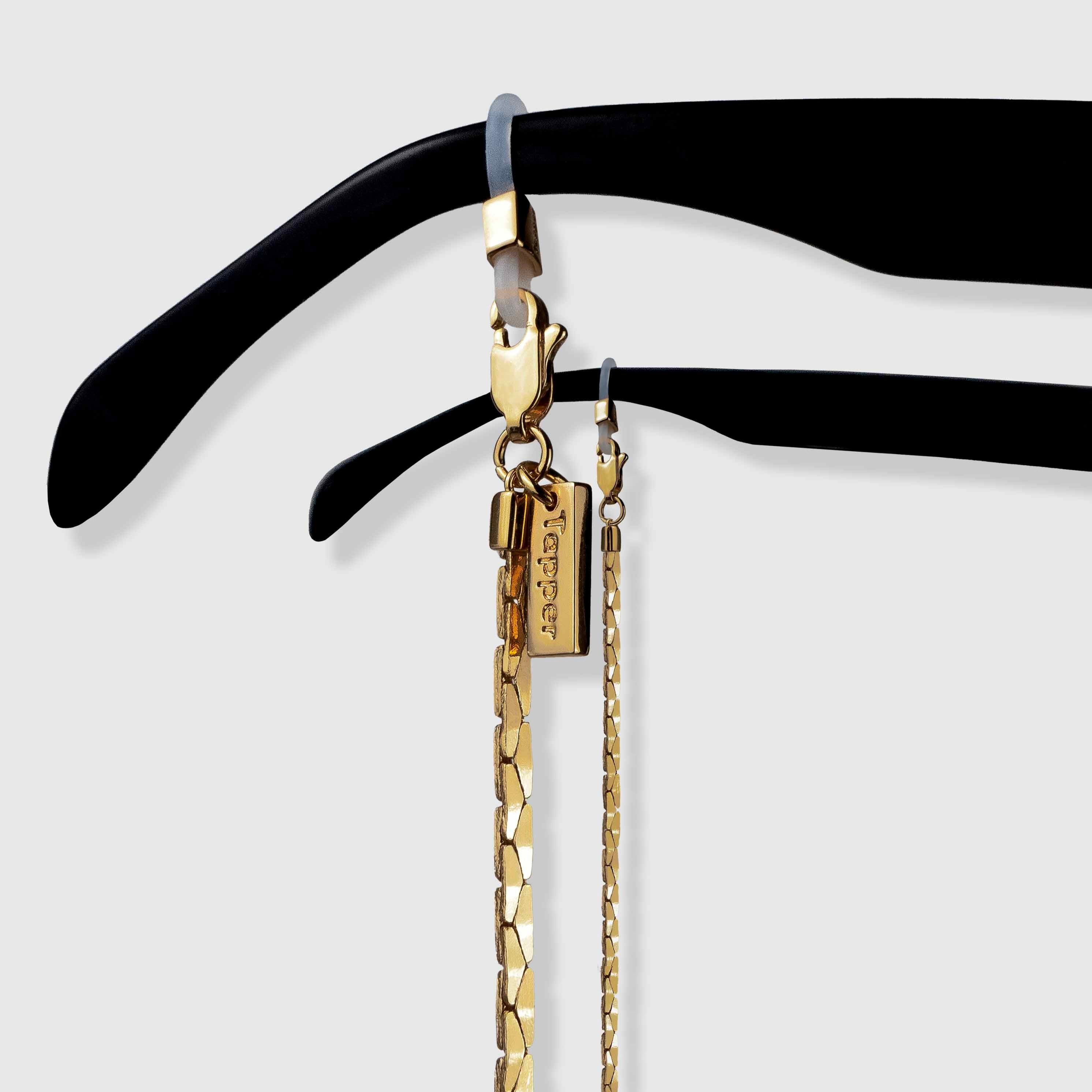 Protect, elevate and keep track of your eyewear with this 18K Gold plated eyewear, eyeglasses and sunglasses chain from Tapper, ensuring elegant and convenient safekeeping around your neck. When not in use as an eyewear chain, detach the silicone holders from the lobster clasps and use it as a necklace, bracelet or pair it with another set of chains as body jewelry / jewellery. Designed in Sweden.
