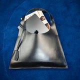Minimalist leather tote bag handmade in Sweden, premium handbag designed for modern work and travel needs.
