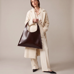 Minimalist leather tote bag handmade in Sweden, premium handbag designed for modern work and travel needs.