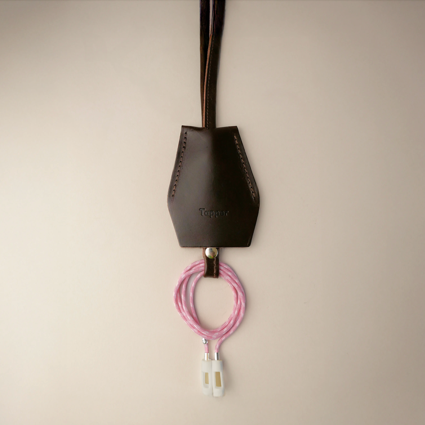 Handmade black leather AirPods strap and leather key holder with keychain and pouch ring, crafted in Sweden