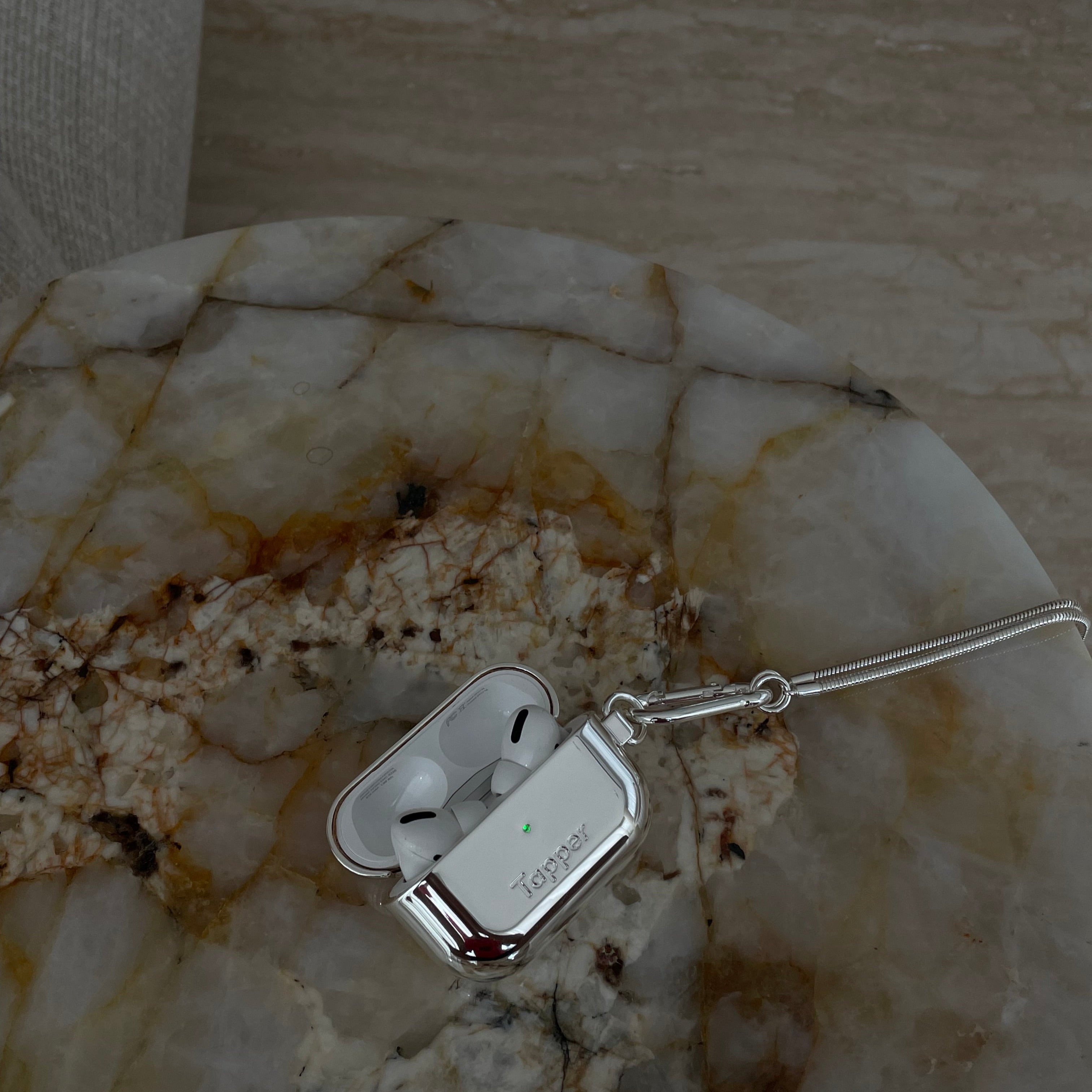 Tapper's real 925 silver plated original metal neck case tech jewelry protects and keeps your Apple AirPods Pro close at hand. The luxurious, elevated and accessible neck case plated in precious metals steps up your AirPods Pro jewellery game. Worried about losing your AirPods? Detachable snake chain and carabiner for convenient and hassle-free safekeeping around your neck. The next must-have accessory crafted for ultimate luxury. Compatible with AirPods Pro. Designed in Sweden. Free Express Shipping.