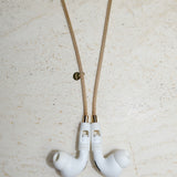 Tapper's solid 18K gold original mesh chain jewelry necklace protects your Apple AirPods & AirPods Pro. Handcrafted in real 18K gold, the exclusive, elevated & accessible mesh chain jewellery snaps the AirPods around your neck. Lost your AirPods? Magnetic lock for convenient and hassle-free safekeeping around your neck. The next must-have & luxe AirPods accessory crafted for ultimate luxury. Compatible with AirPods & AirPods Pro. Designed and handcrafted in Sweden by Tapper. Free Shipping at gettapper.com