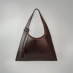 Large premium leather tote bag handmade in Sweden, a sculptural tote bag and handbag designed for work and travel, crafted from vegetable-tanned leather and sized to function as a leather laptop bag fitting up to a 16-inch laptop.