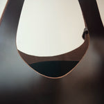 Tote bag and handbag made from premium vegetable-tanned leather, designed to carry a laptop up to 16 inches.