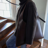 Premium leather tote bag crafted from vegetable-tanned leather, a refined handbag for work and travel.