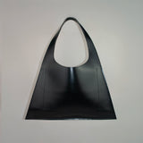 Minimalist leather tote bag handmade in Sweden, premium handbag designed for modern work and travel needs.