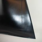 Minimalist leather tote bag handmade in Sweden, premium handbag designed for modern work and travel needs.
