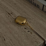 Tapper's real 18K gold plated original metal neck case jewelry protects your Apple AirPods Pro. Luxurious, elevated & accessible AirPods Pro jewellery plated in precious metals. Worried about losing your AirPods Pro? Detachable snake chain and carabiner for convenient and hassle-free safekeeping around your neck. The next must-have AirPods Pro accessory crafted for ultimate luxury. Compatible with AirPods Pro. Designed in Sweden by Tapper. Free Express Shipping at gettapper.com