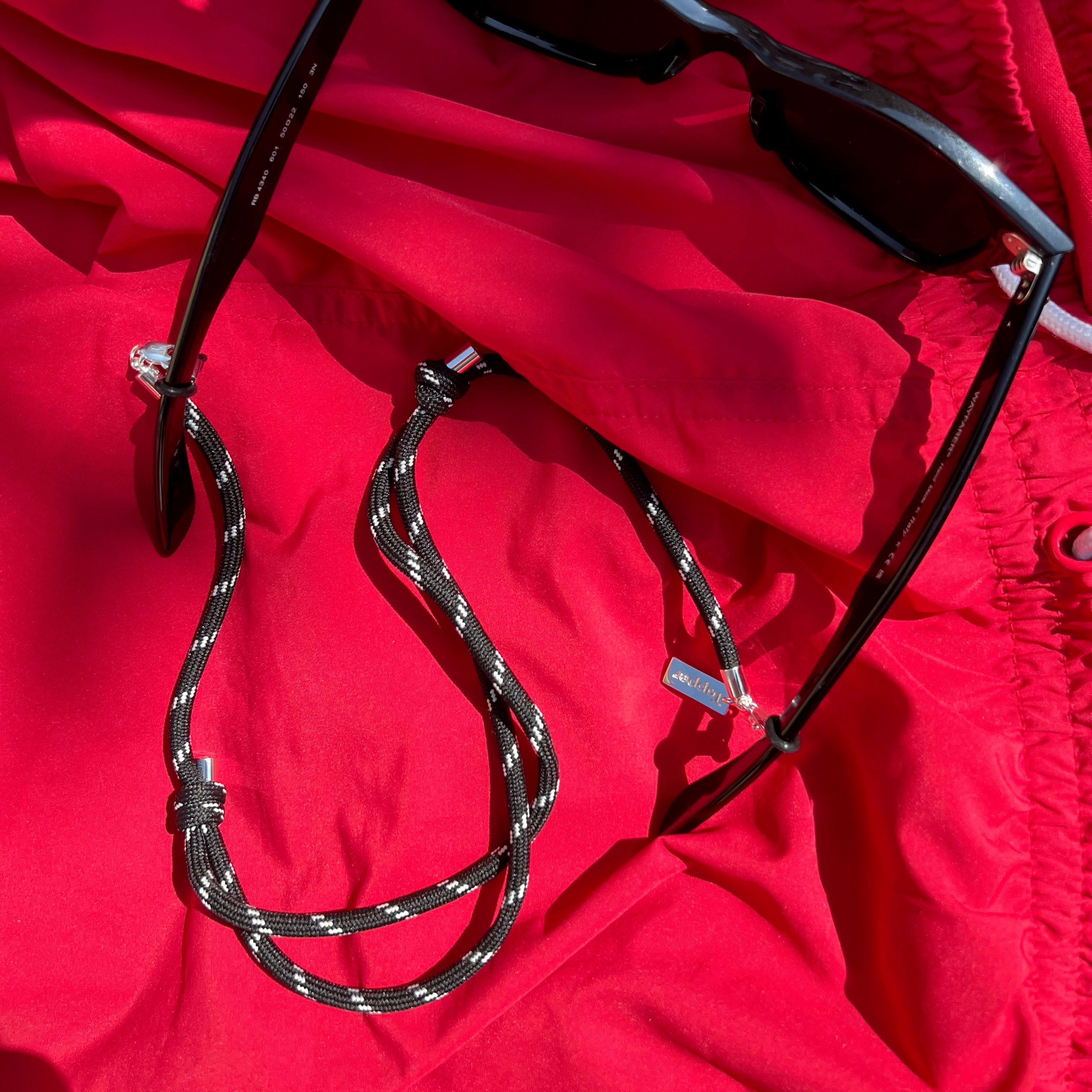 Tapper Black Adjustable Eyewear and Glasses Nylon Strap. Adjust for the perfect length and fit. Good for an active lifestyle on the go, running, long walks, traveling and easy to style both casual and fashionable. 