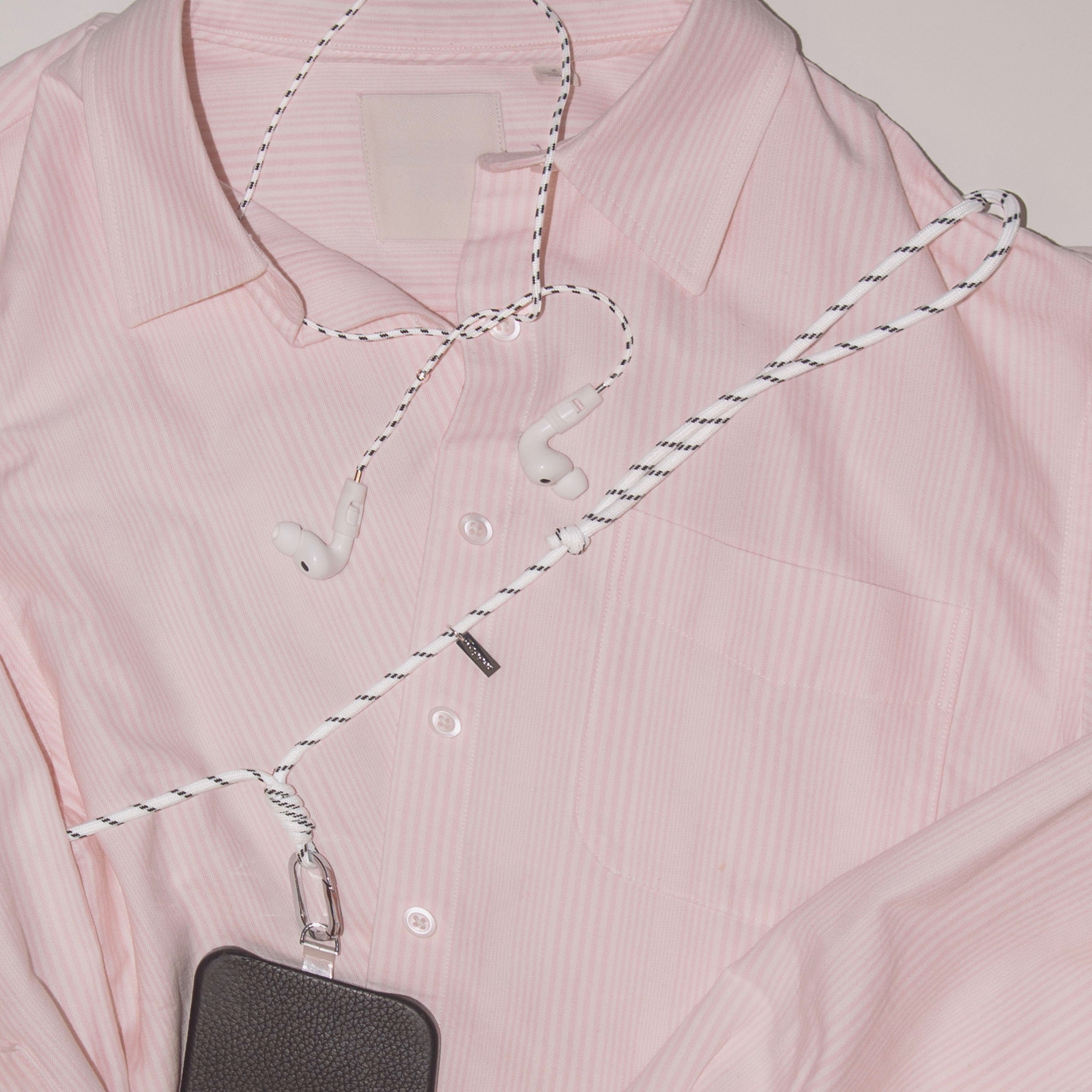 Never lose or misplace your AirPods again. Let the lightweight and durable Tapper Nylon AirPods Strap Necklace keep track of your AirPods and AirPods Pro by eliminating the need to hold them in your hands, drop them into your pockets, or risk losing them if they fall out of your ears. Comes with a built-in magnetic lock that snaps the AirPods around your neck, forming a sleek necklace and making them easily accessible. AirPods Strap compatible with Apple AirPods & AirPod Pro (1st, 2nd, 3rd, 4th generation)