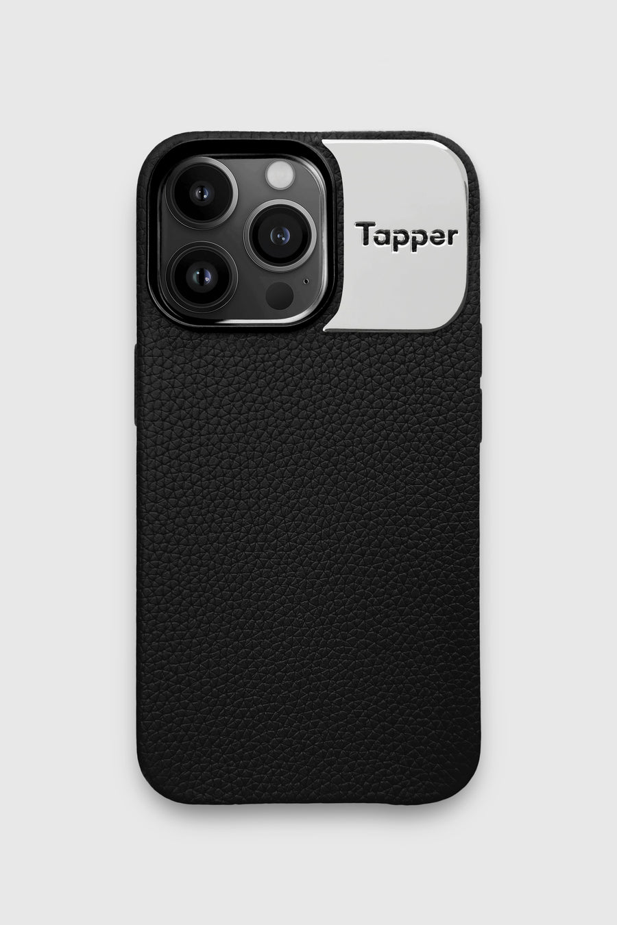 Tapper's luxurious black genuine cow leather iPhone 13 Pro case with MagSafe and a metal logo plate colored in silver that protects and elevates the look of your iPhone 13 Pro. The next must-have high end protective Apple iPhone accessory in real leather and metal details.  Designed in Sweden by Tapper. Free Express Shipping at gettapper.com