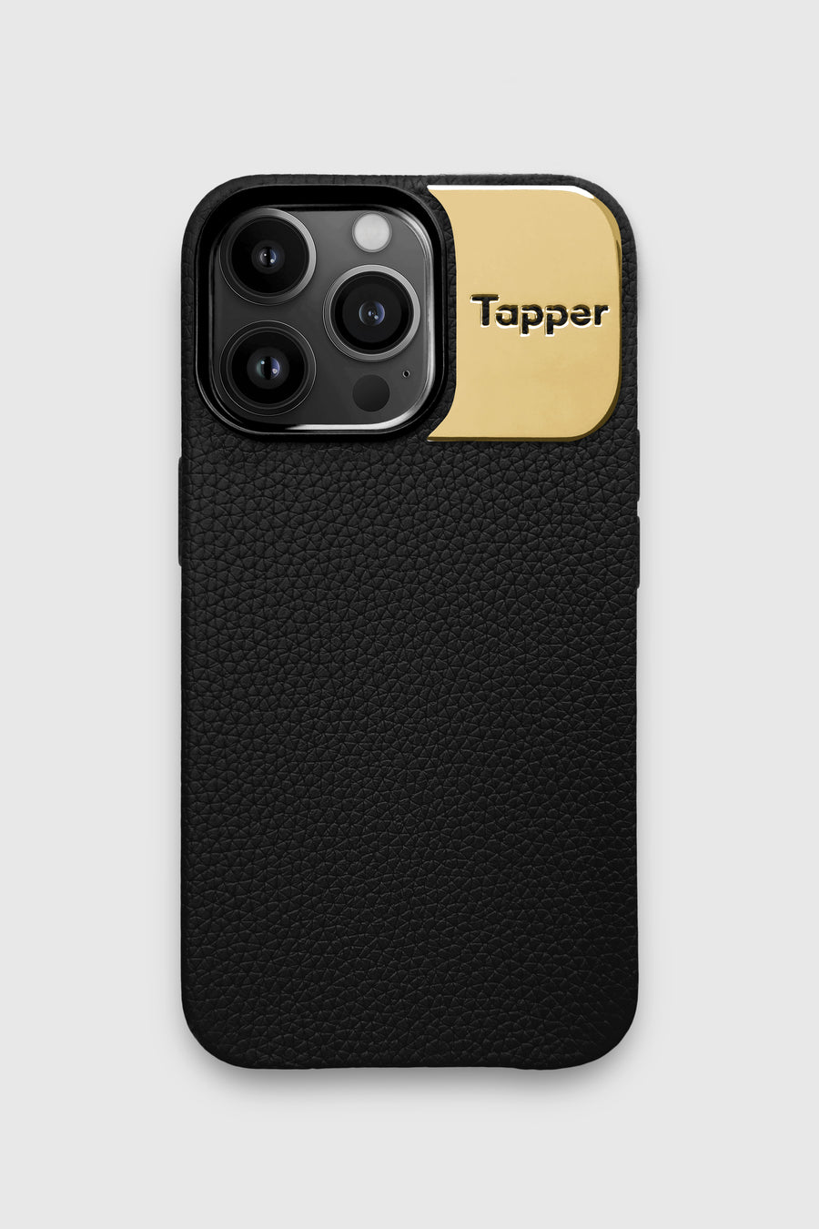Tapper's luxurious black genuine cow leather iPhone 13 Pro case with MagSafe and a metal logo plate in 18k gold plating that protects and elevates the look of your iPhone 13 Pro. The next must-have high end protective Apple iPhone accessory in real leather and precious metals.  Designed in Sweden by Tapper. Free Express Shipping at gettapper.com