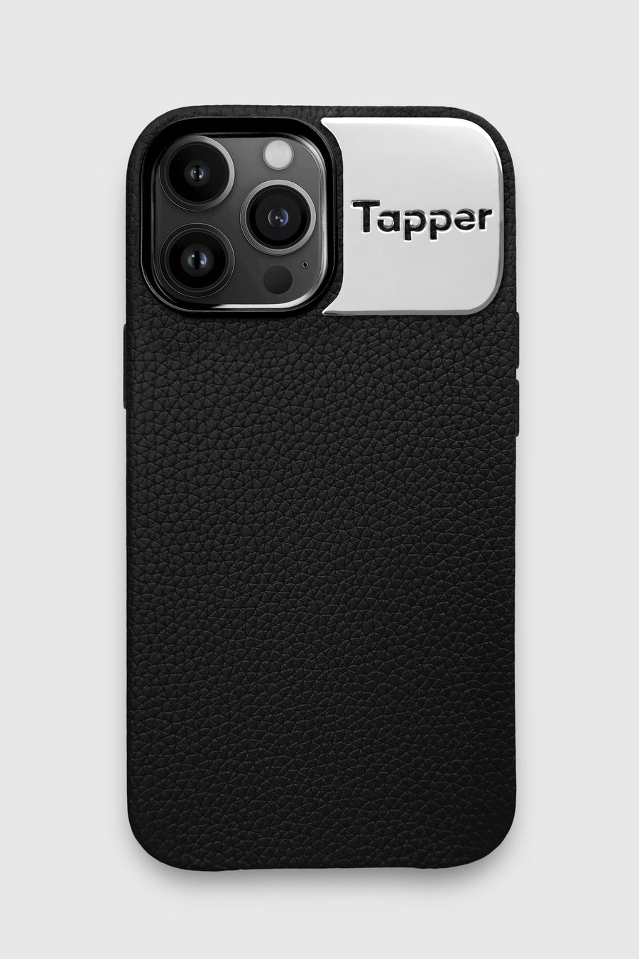 Tapper's luxurious black genuine cow leather iPhone 13 Pro Max case with MagSafe and a metal logo plate colored in silver that protects and elevates the look of your iPhone 13 Pro. The next must-have high end protective Apple iPhone accessory in real leather and metal details. Designed in Sweden by Tapper. Free Express Shipping at gettapper.com